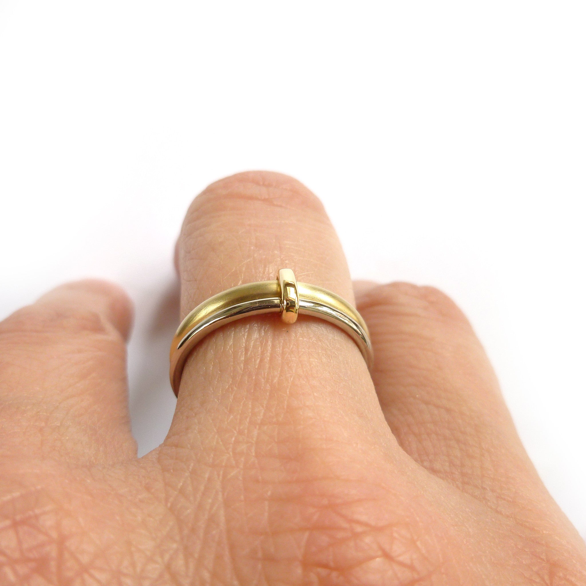unique wedding ring linking together two bands of gold