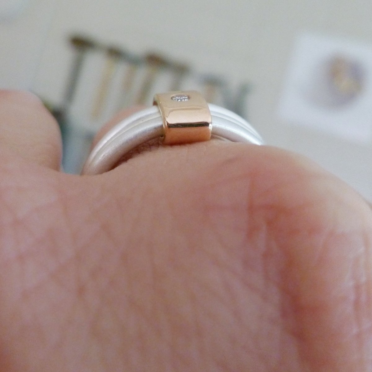 silver and rose gold ring