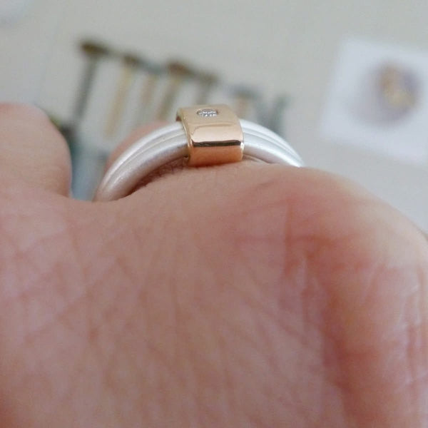 silver and rose gold ring