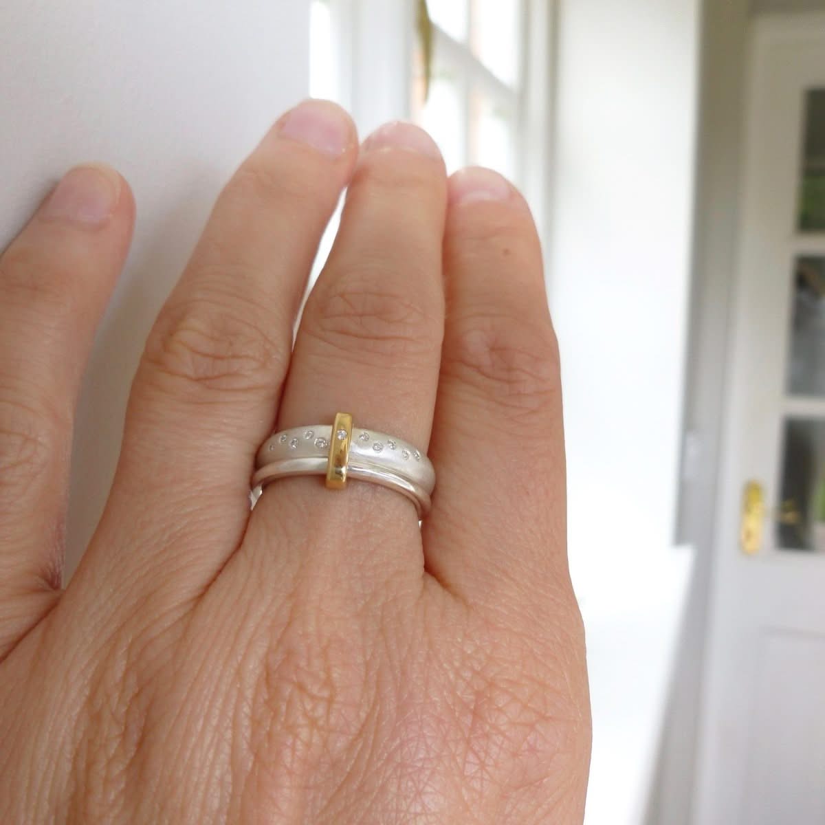 Modern unique and bespoke contemporary silver gold and diamond eternity style two band stacking ring by Sue Lane