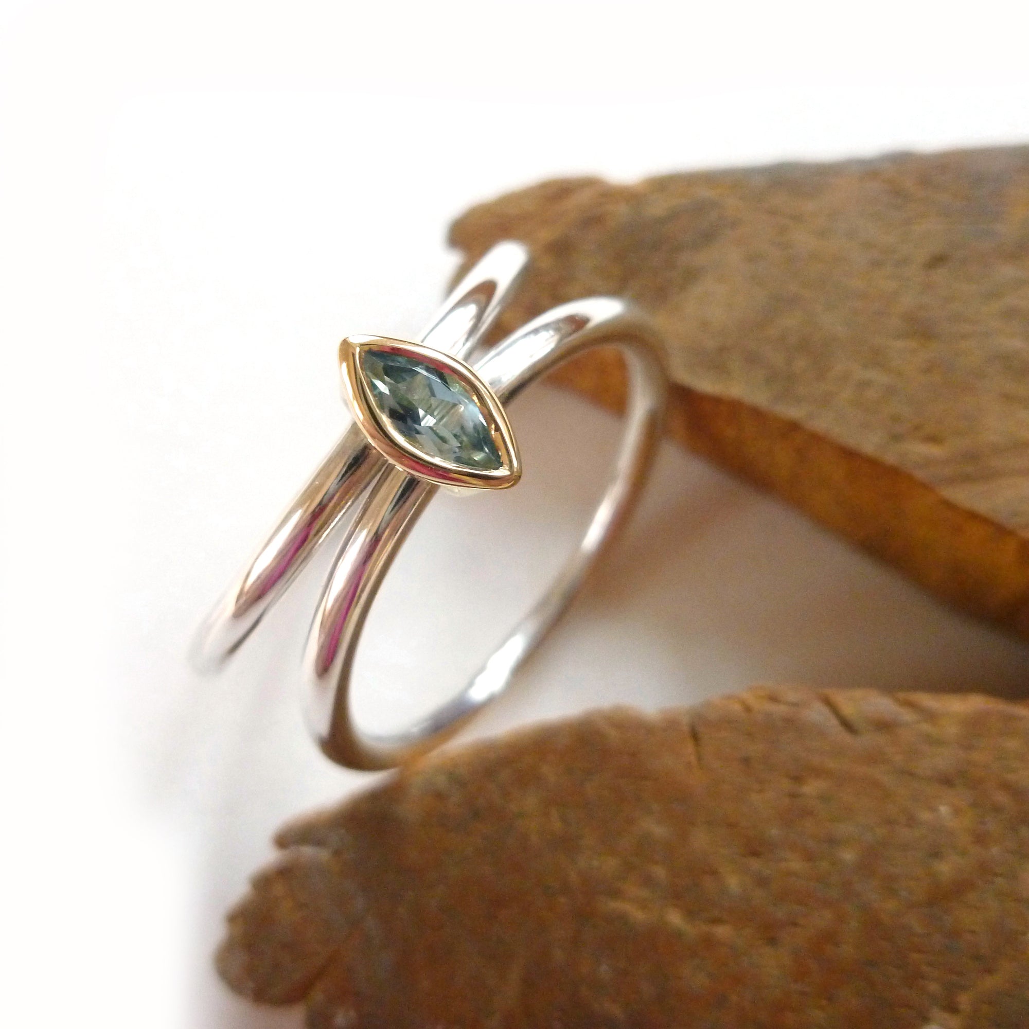 modern unusual silver and gold ring with aquamarine by contemporary jewellery designer Sue Lane 