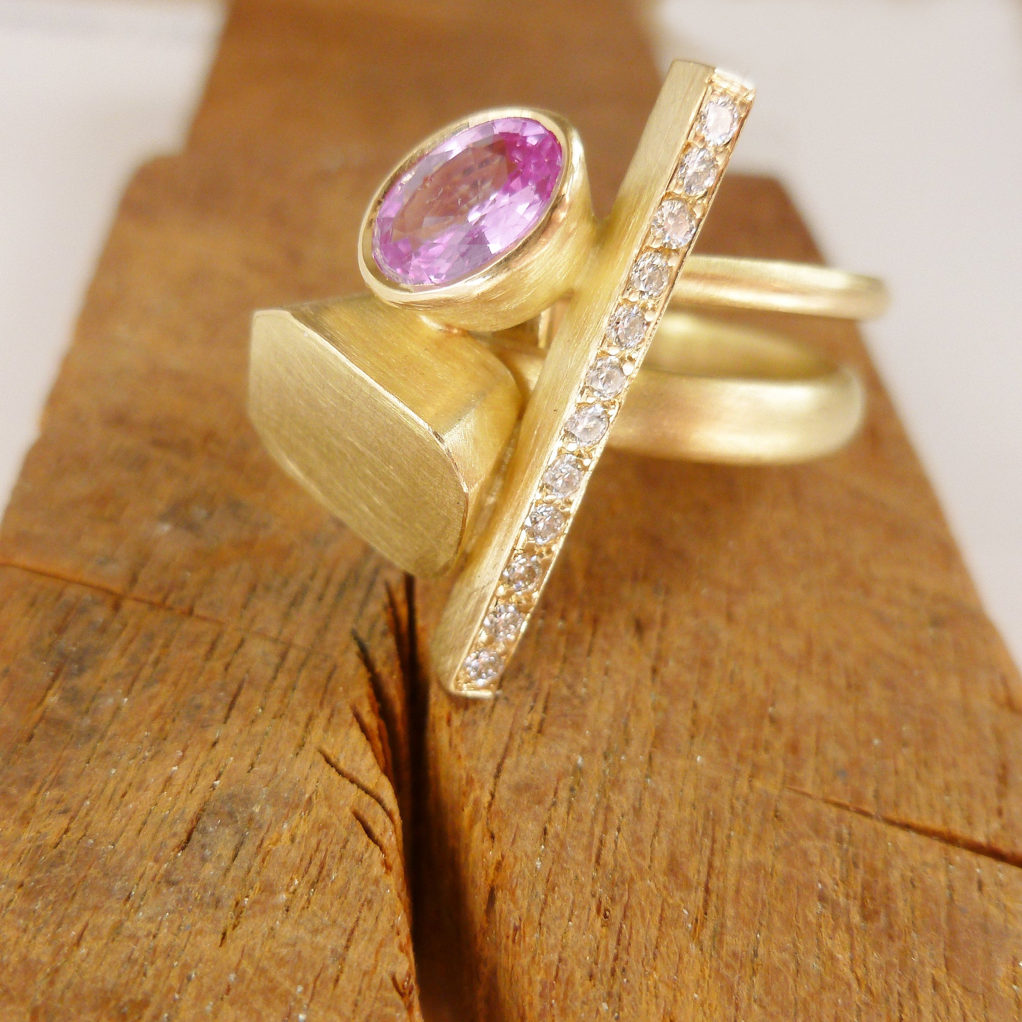 Pink sapphire and diamond and yellow gold ring