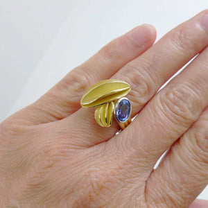 contemporary gold platinum and tanzanite ring with gold leaf shape detail handmade by Sue Lane UK