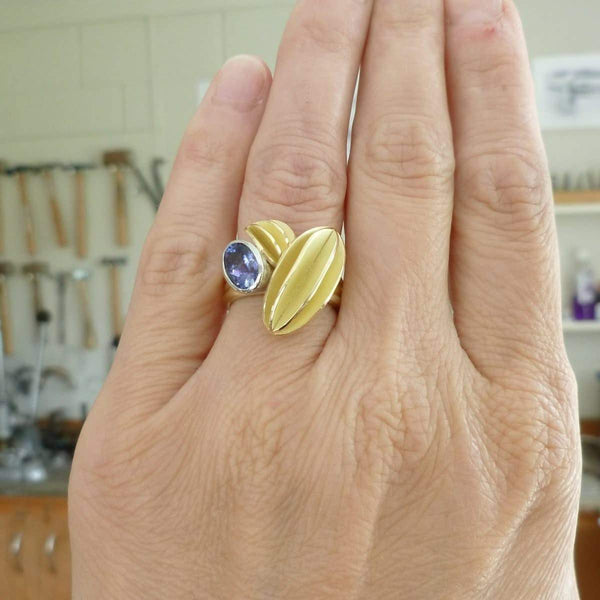 Unique contemporary gold, platinum and tanzanite ring with gold leaf shape detail