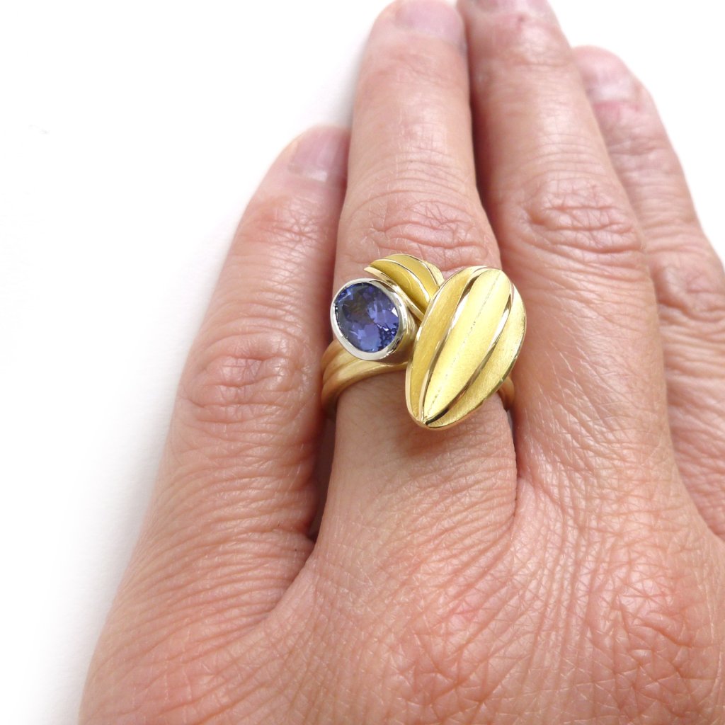 Unique contemporary gold, platinum and tanzanite ring with gold leaf shape detail