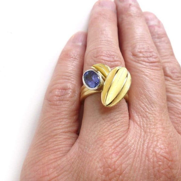 Unique contemporary gold, platinum and tanzanite ring with gold leaf shape detail