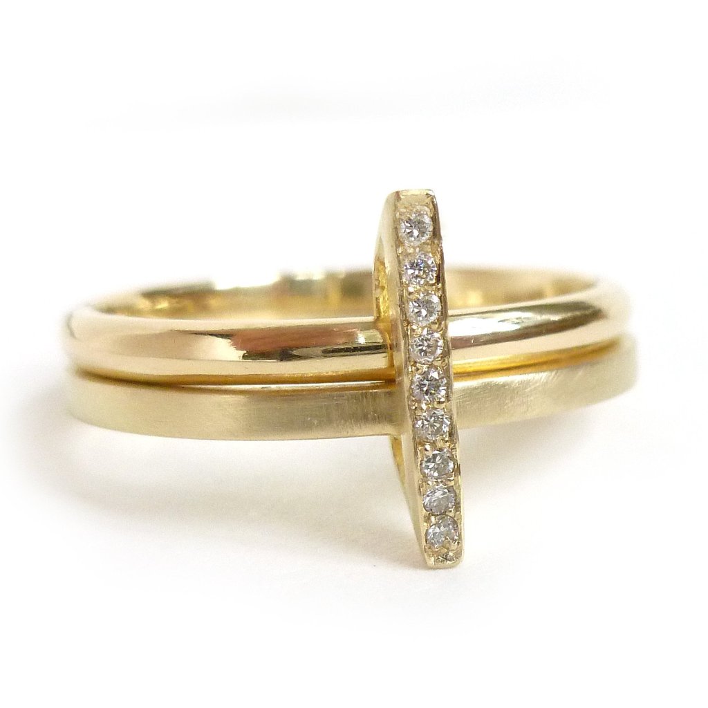 A unique, contemporary diamond ring. Multi band ring or interlocking ring, sometimes called double band ring too.