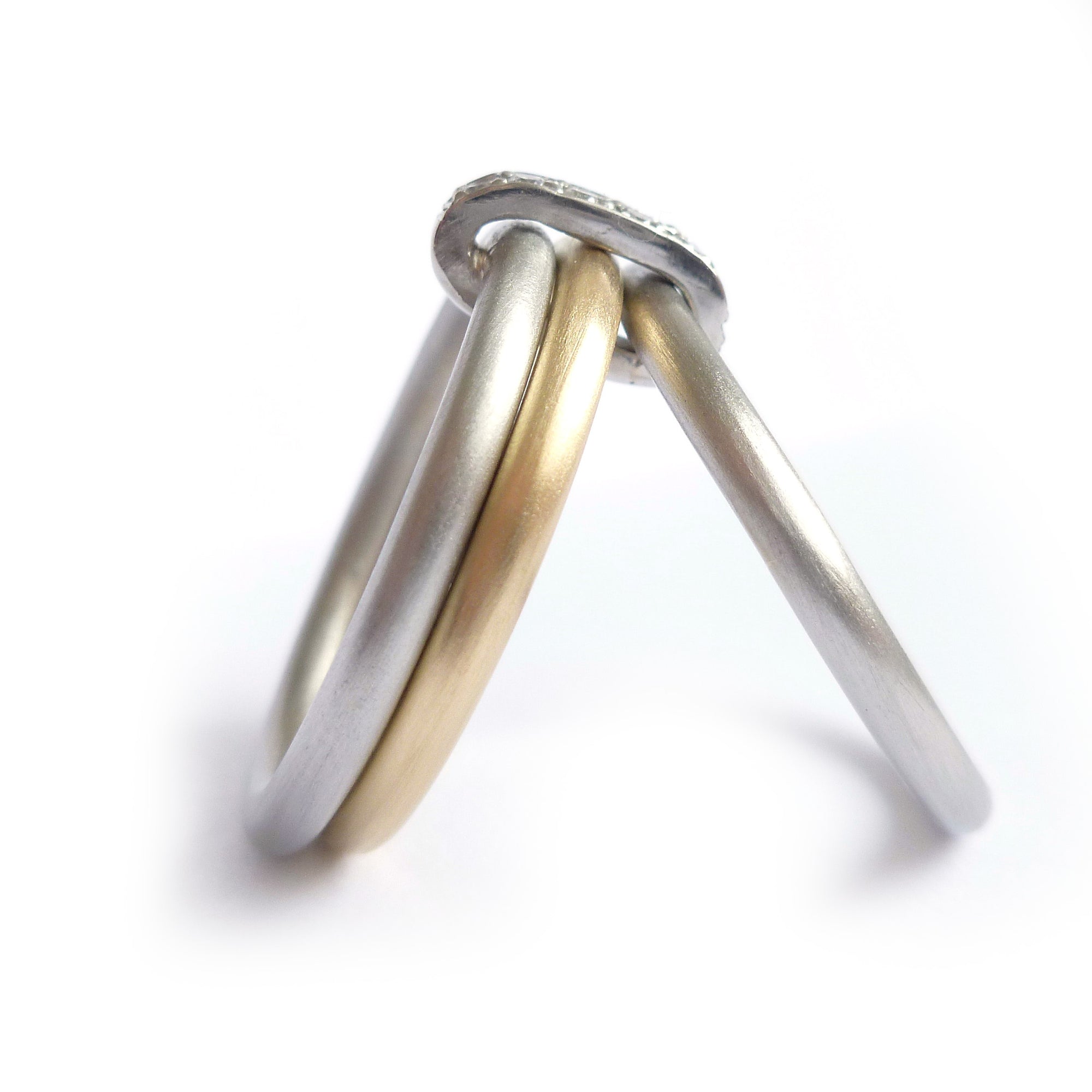 Handmade three band ring, joined together with a band of diamonds handmade by Sue Lane UK - gold platinum. Multi band ring or interlocking ring, sometimes called triple band rings too.