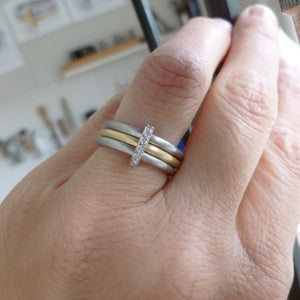 Handmade three band ring, joined together with a band of diamonds handmade by Sue Lane UK - platinum gold. Multi band ring or interlocking ring, sometimes called triple band rings too.