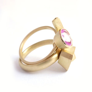 modern and contemporary gold and pink sapphire ring with pave diamonds