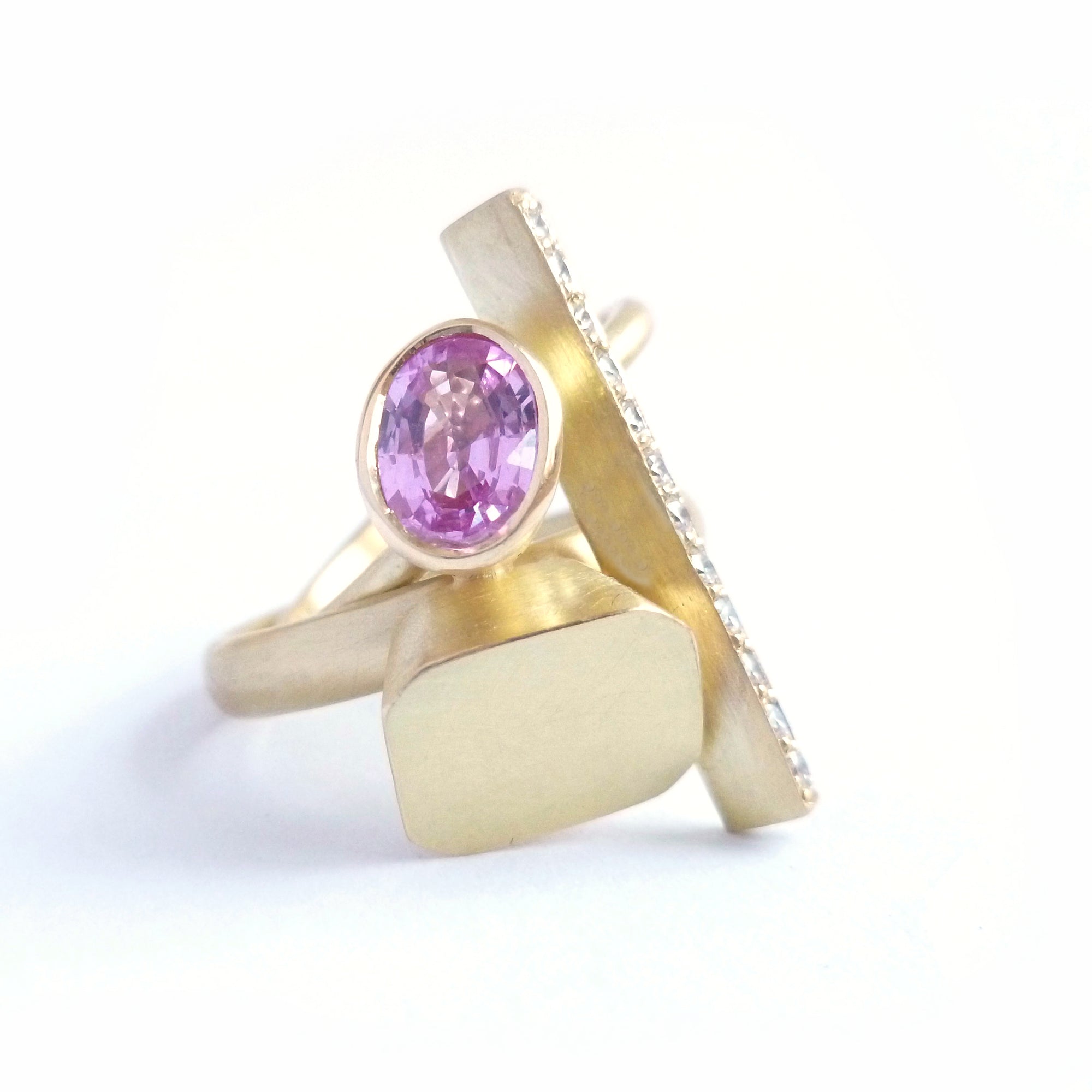 modern and contemporary gold and pink sapphire ring with pave diamonds