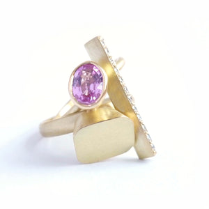 modern and contemporary gold and pink sapphire ring with pave diamonds