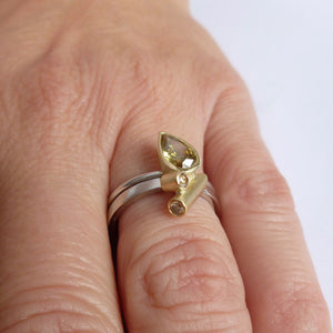 bespoke platinum and gold ring with natural green pear shape diamond with GIA certification