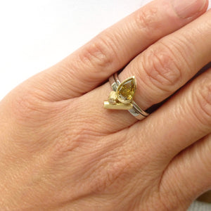Contemporary bespoke platinum and gold ring with natural green pear shape diamond with GIA certification