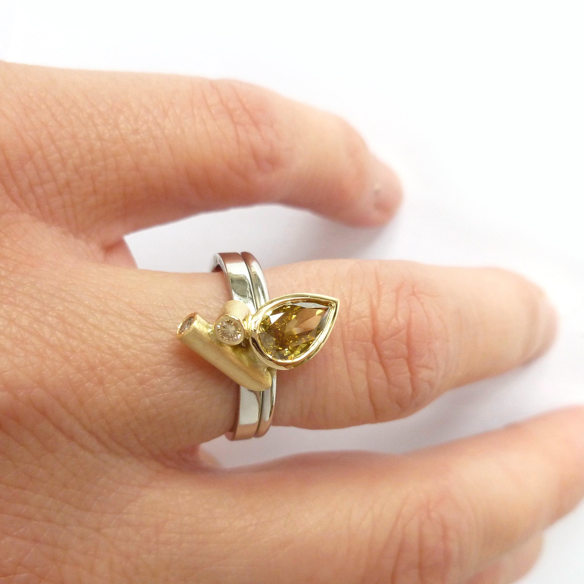 bespoke platinum and gold ring with natural green pear shape diamond with GIA certification