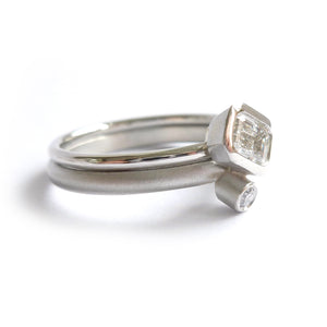stacking modern platinum and emerald cut diamond engagement and wedding ring