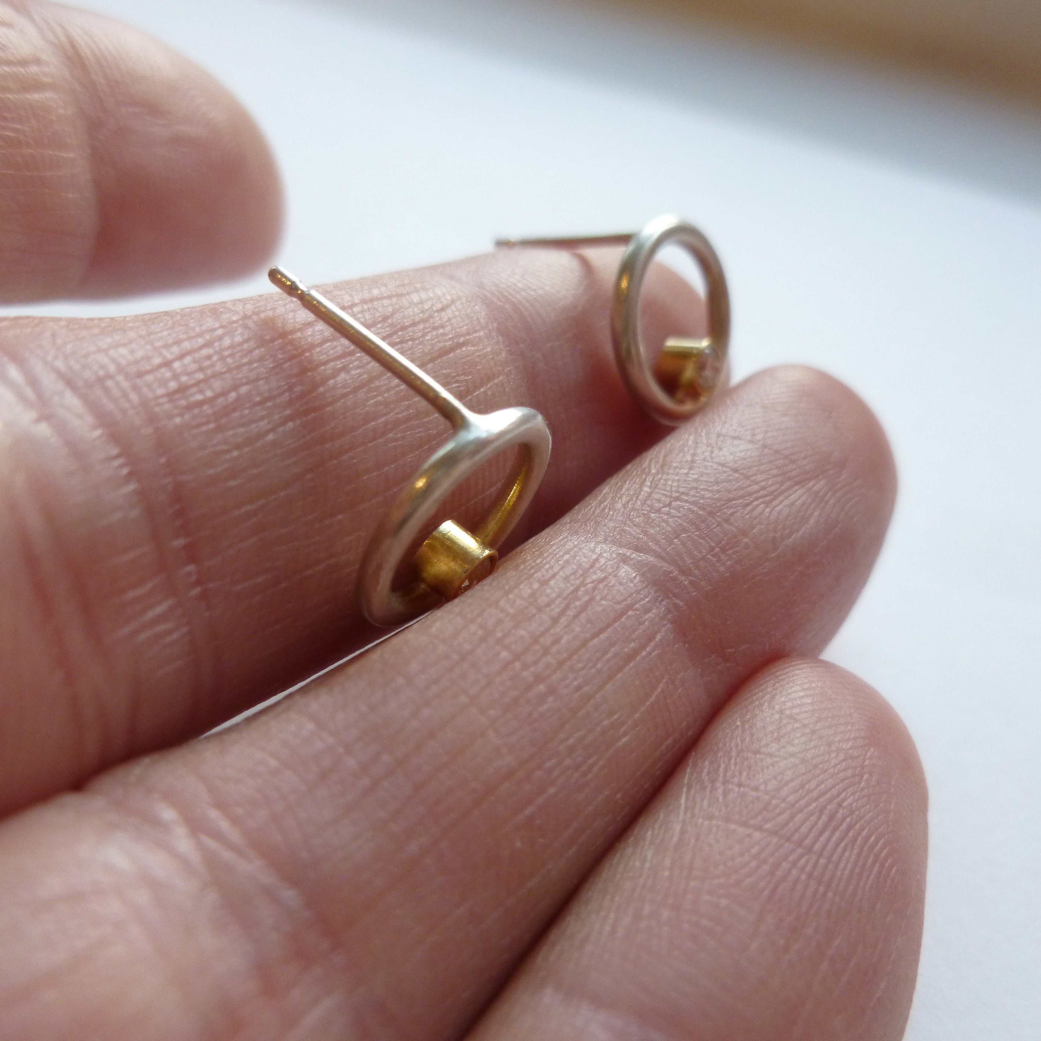 Contemporary, bespoke, unique and modern silver and 18ct white gold circle earrings with 2mm diamonds