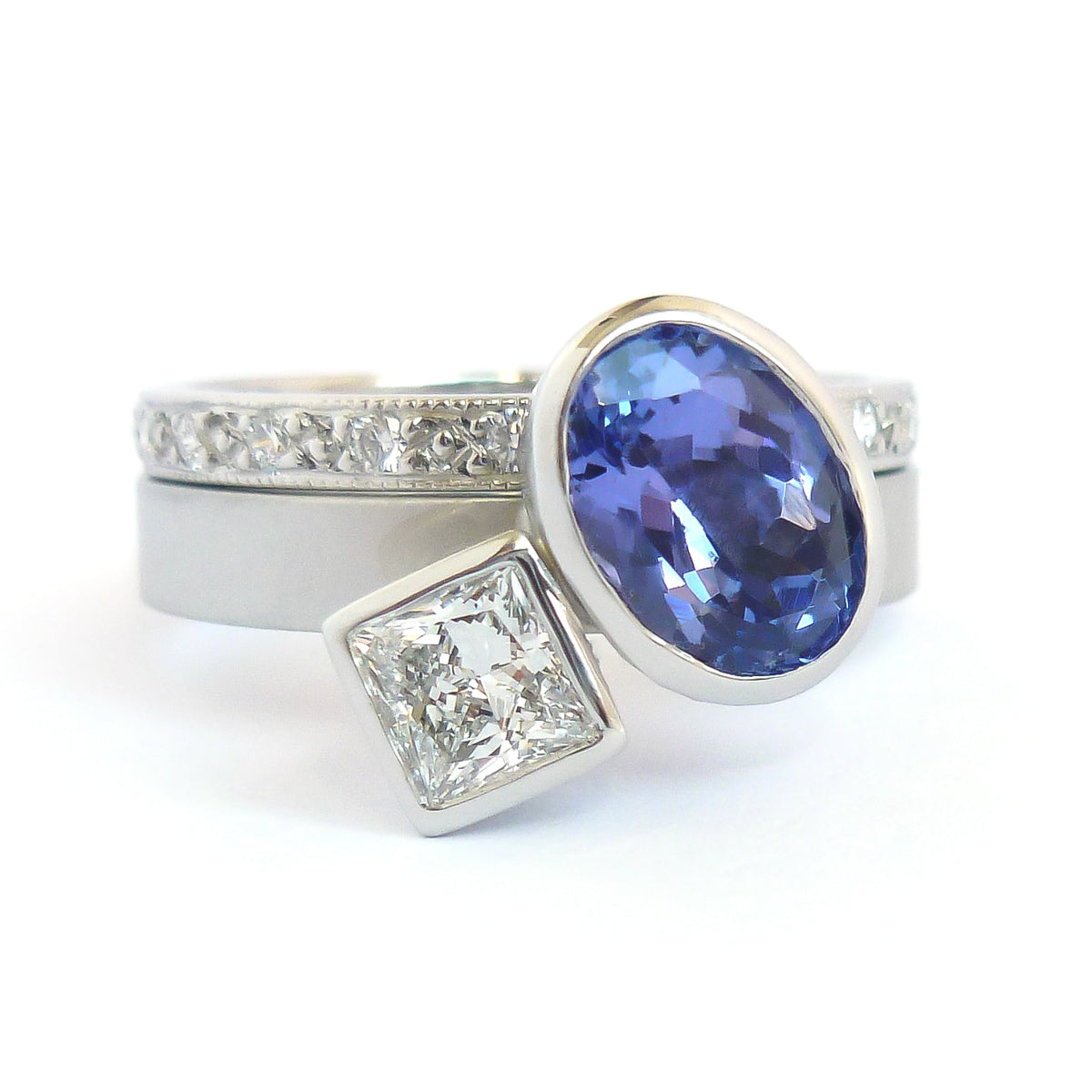 Platinum and tanzanite two band stacking ring set - contemporary, modern, bespoke and unique - interlocking.