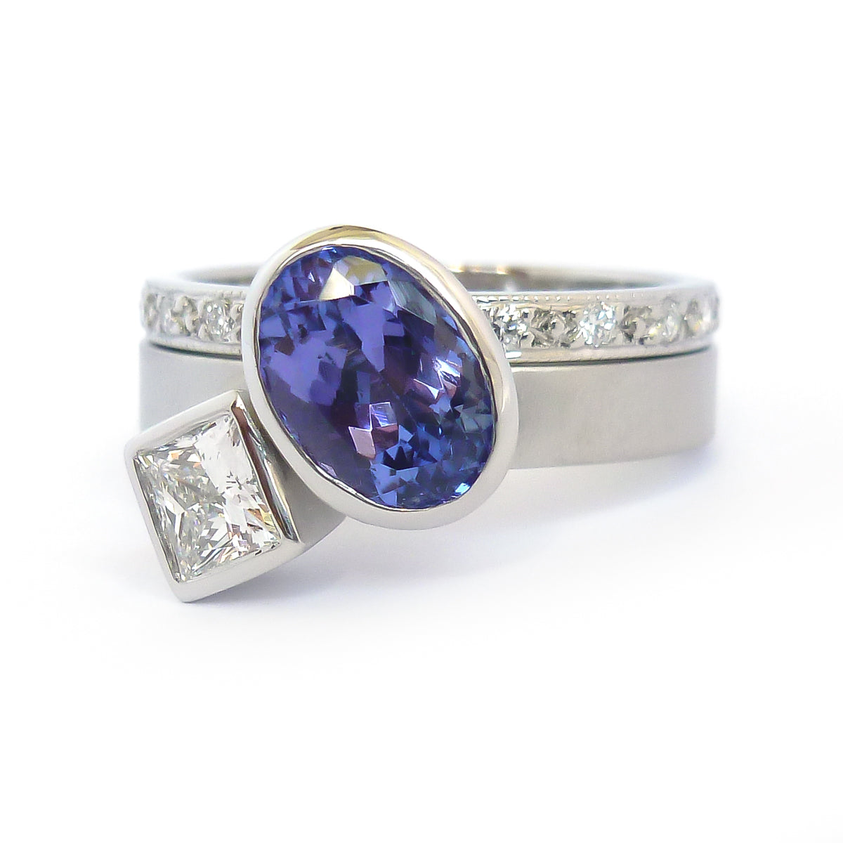 Platinum and tanzanite two band stacking ring set - contemporary, modern, bespoke and unique - interlocking.