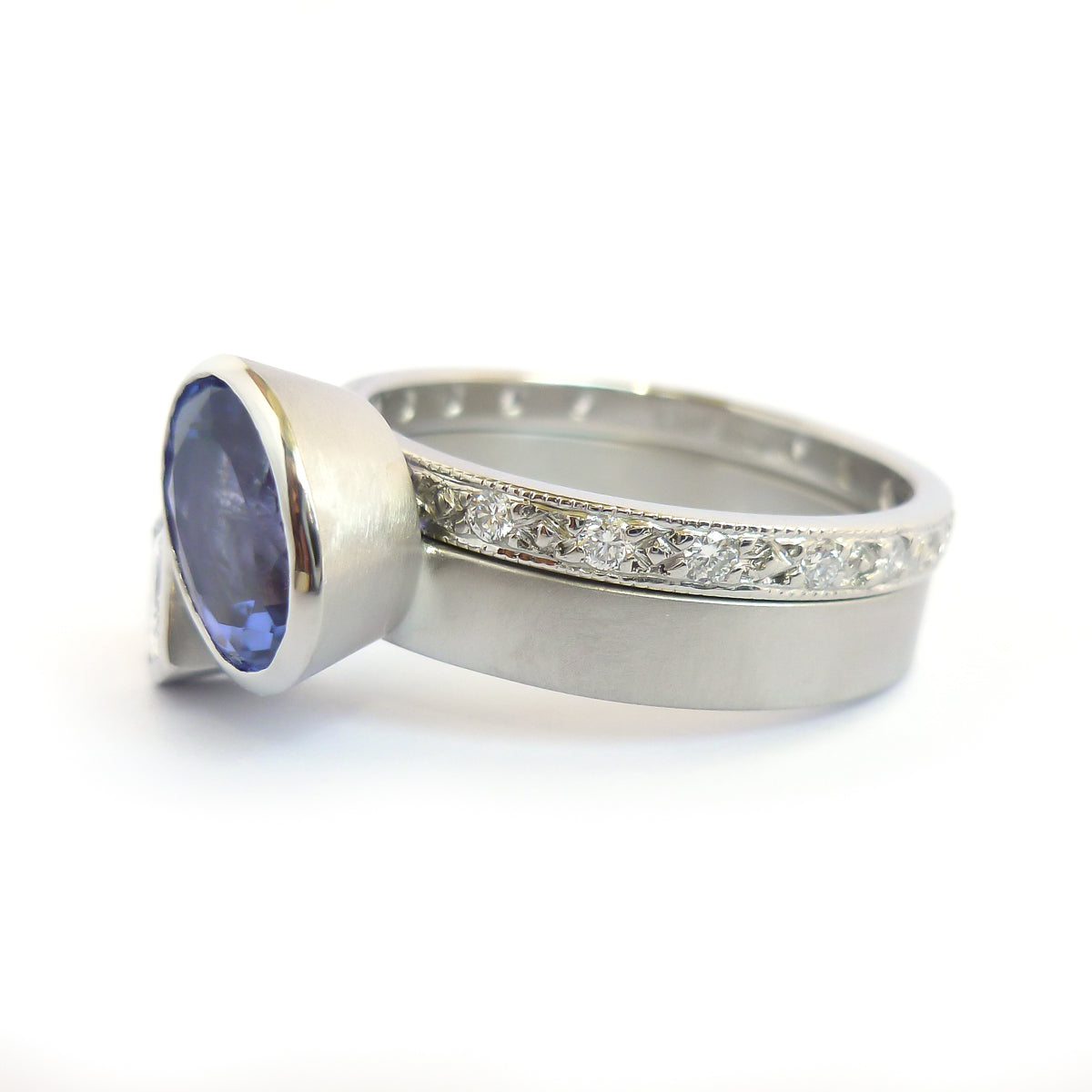 Platinum and tanzanite two band stacking ring set - contemporary, modern, bespoke and unique - interlocking.
