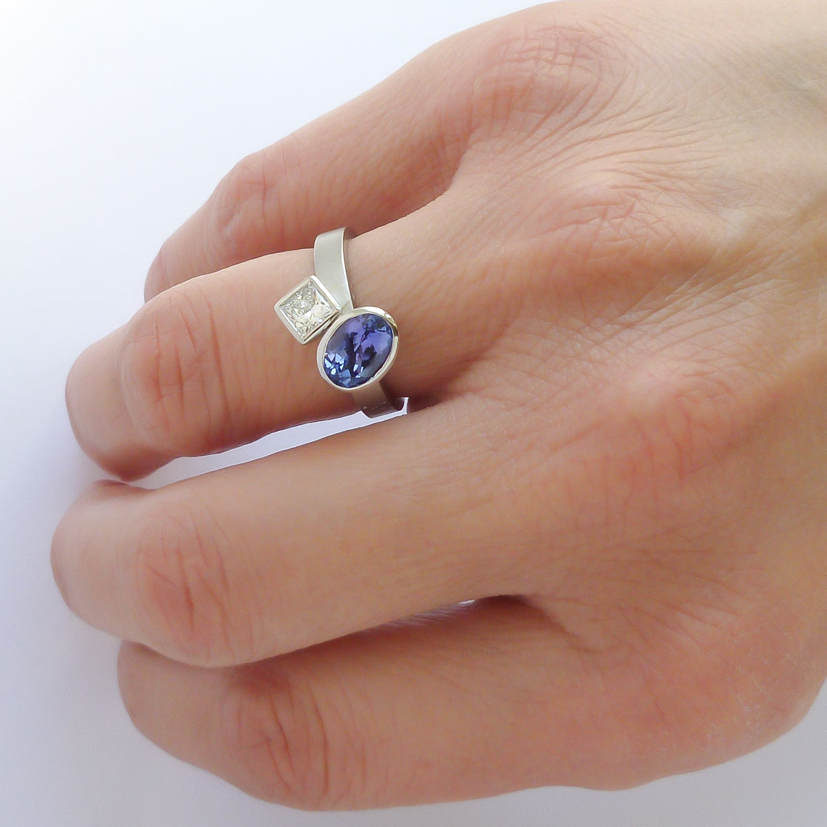 Platinum and tanzanite two band stacking ring set - contemporary, modern, bespoke and unique - interlocking.