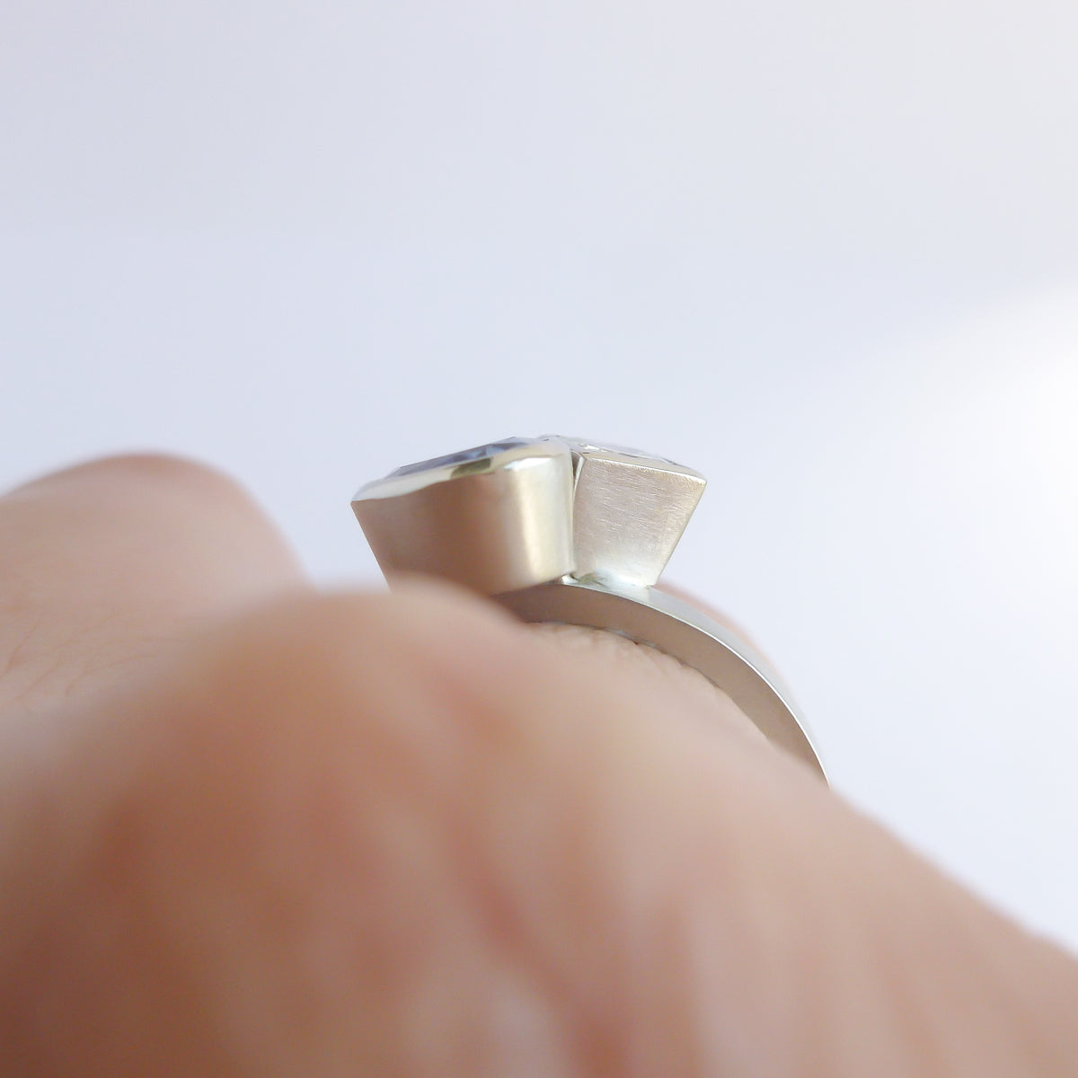 Platinum and tanzanite two band stacking ring set - contemporary, modern, bespoke and unique - interlocking.