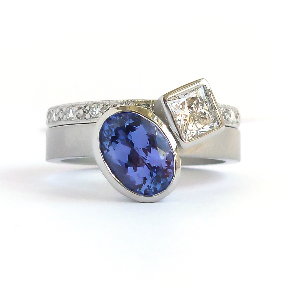 Platinum and tanzanite two band stacking ring set - contemporary, modern, bespoke and unique - interlocking.