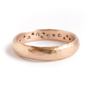 A modern unique rose gold eternity ring with 14 diamonds. Beautiful contemporary eternity ring, perfect for everyday wear.