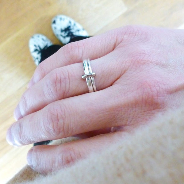 Handmade silver and 18ct gold double band spinner ring worn on hand, showing the contemporary unique design.
