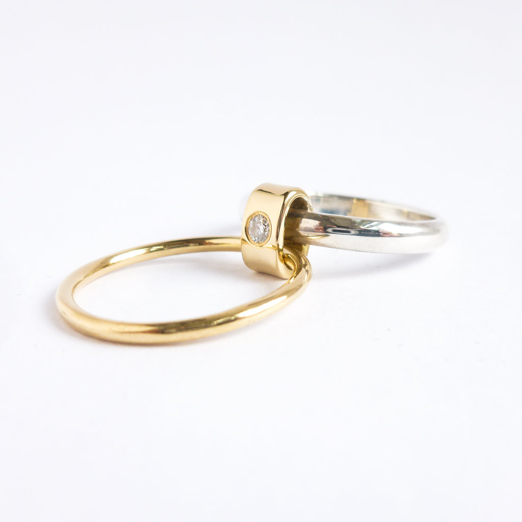 Contemporary unique bespoke wedding engagement ring silver gold diamonds.