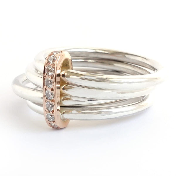 Four band luxury handmade spinner ring in solid silver with diamonds set in gold