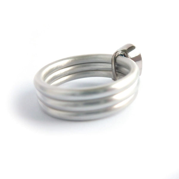 A unique, contemporary aquamarine and diamond gold and silver ring