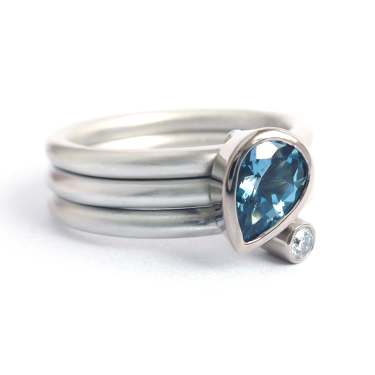 A unique, contemporary aquamarine and diamond gold and silver ring