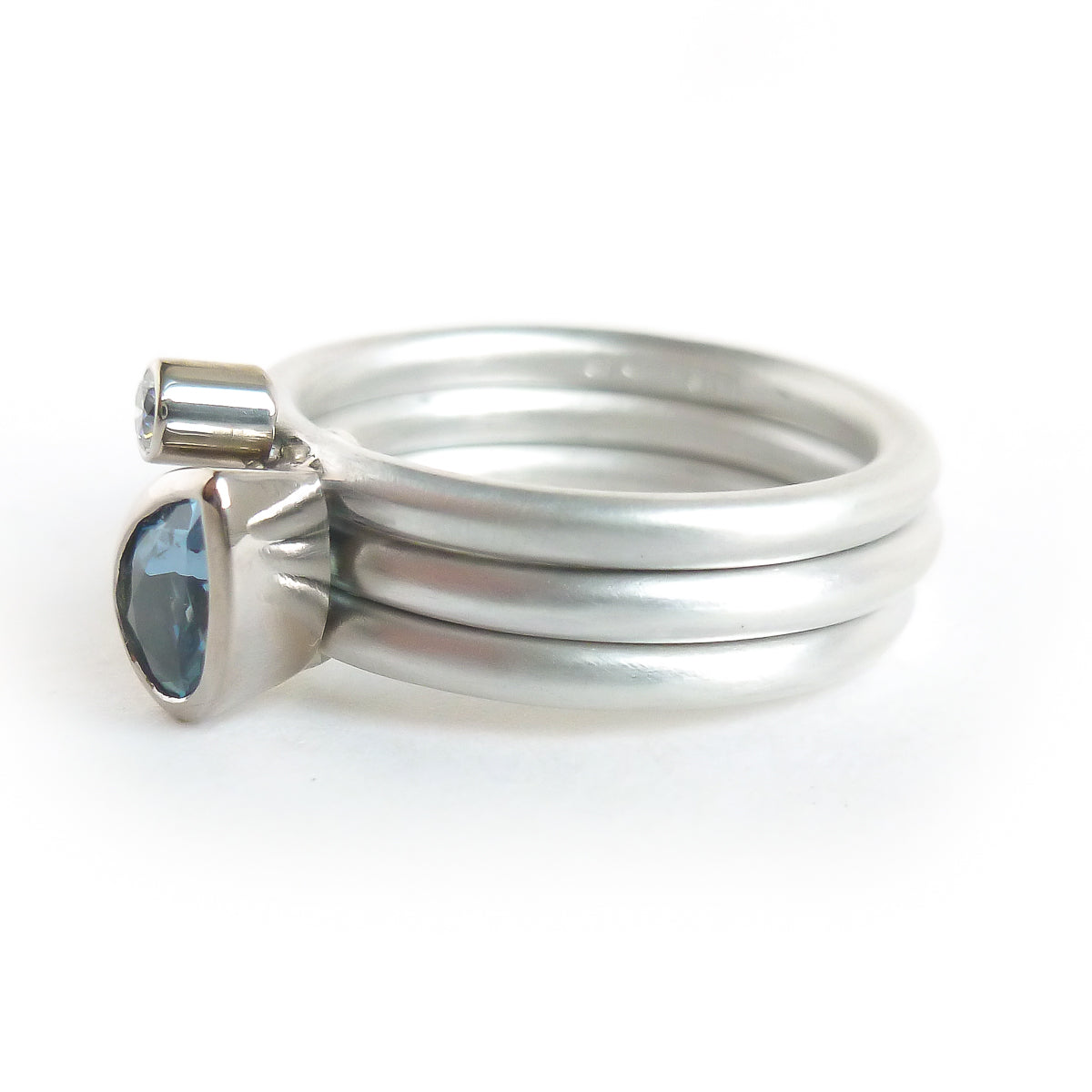 A unique, contemporary aquamarine and diamond gold and silver ring