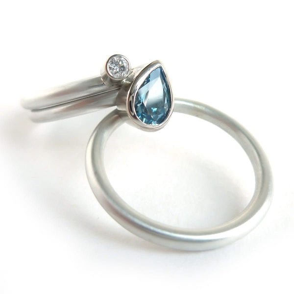 A unique, contemporary aquamarine and diamond gold and silver ring