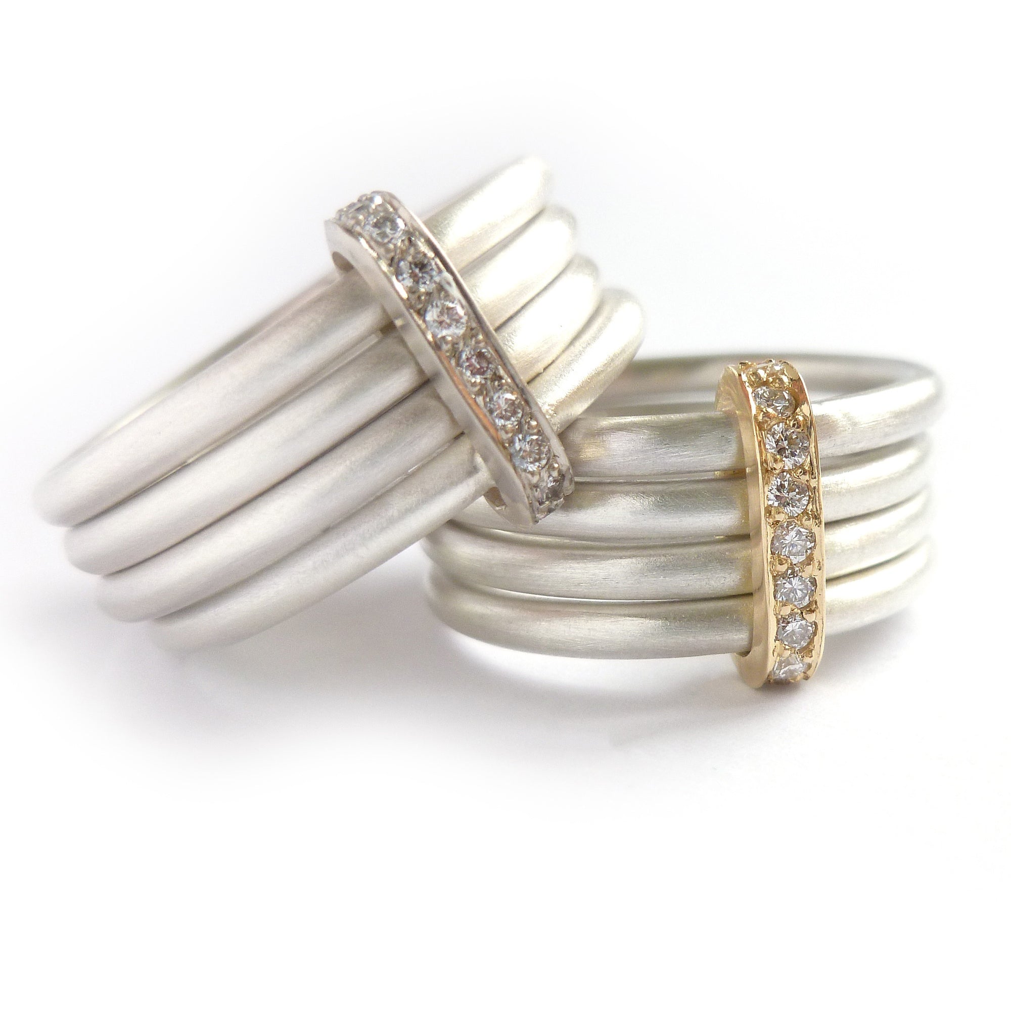 Unique contemporary wide band silver and gold ring with white diamonds