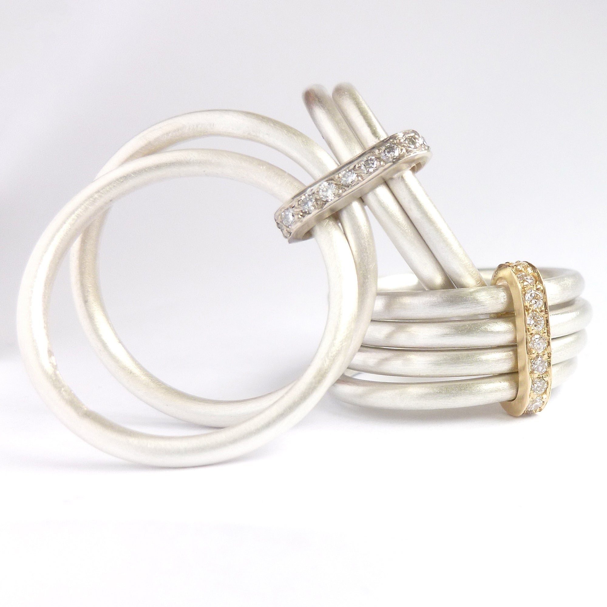 Four 4 band modern contemporary silver and gold two tone pave set diamond ring handmade by Sue Lane