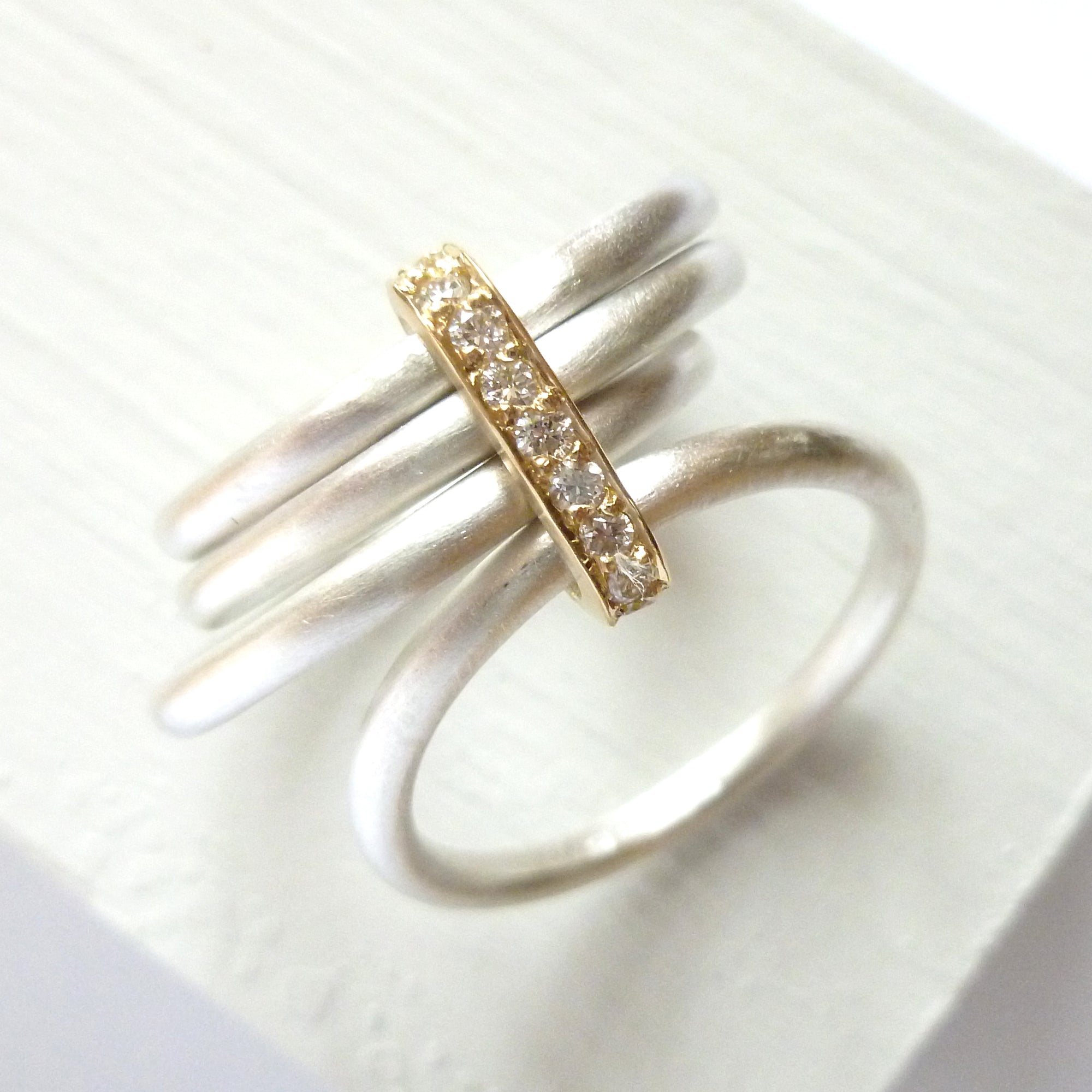 Four 4 band modern contemporary silver and gold two tone pave set diamond ring handmade by Sue Lane