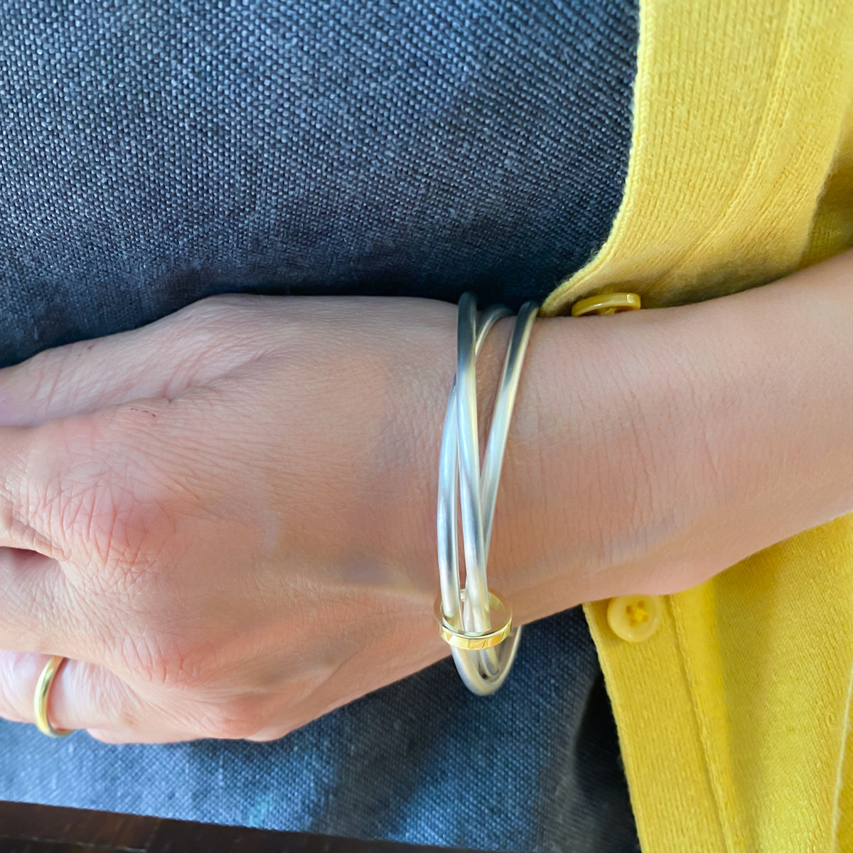 Unusual, unique, bespoke and modern silver and gold Russian style bangle with brushed finish. Handmade by Sue Lane Jewellery in Herefordshire, UK