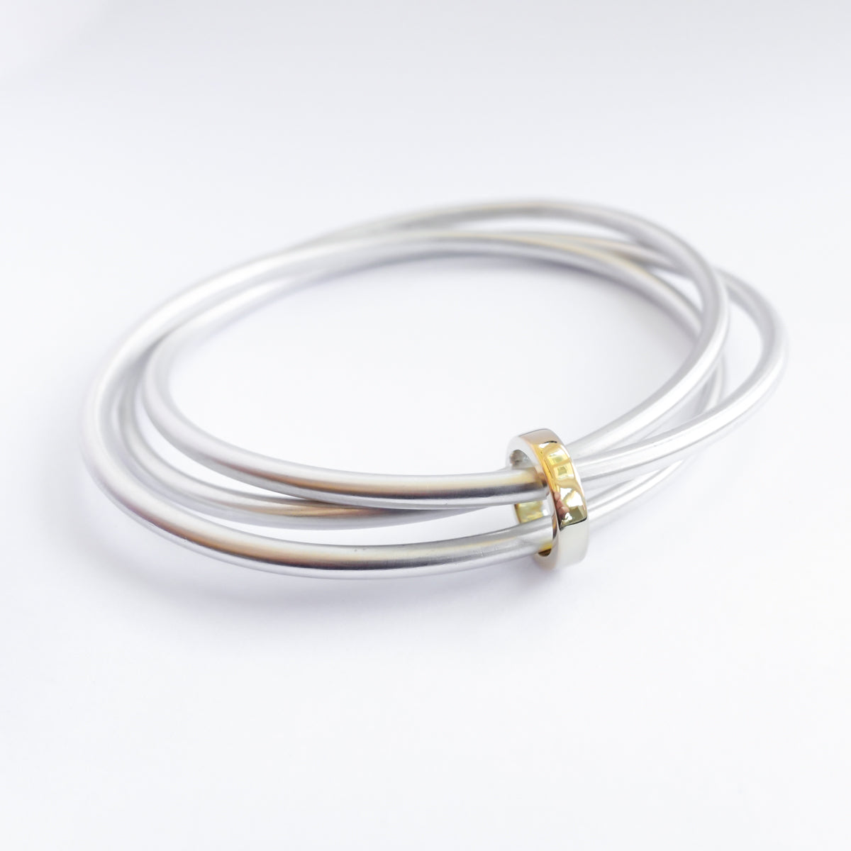 Unusual, unique, bespoke and modern silver and gold Russian style bangle with brushed finish. Handmade by Sue Lane Jewellery in Herefordshire, UK