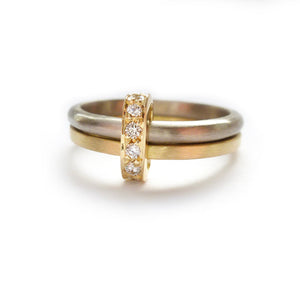 Modern and bespoke two band two tone ring with pave set diamonds. Modern, unique two band ring joined together with diamonds. An alternative eternity or wedding ring. Multi band ring or interlocking ring, sometimes called double band ring too.