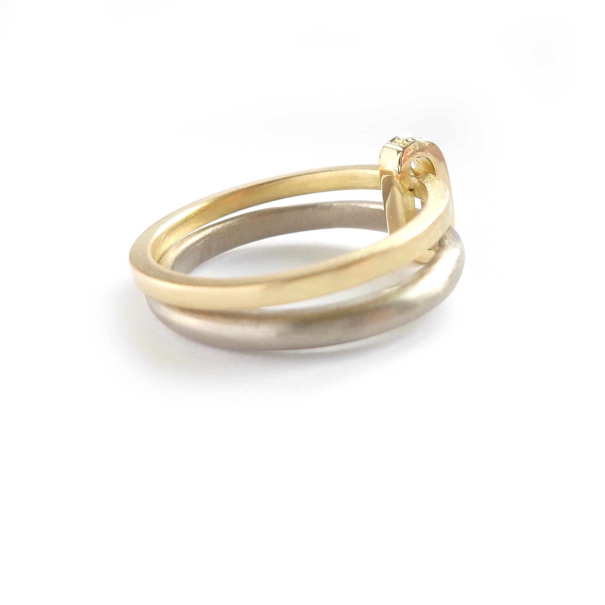 Modern and bespoke two band two tone ring with pave set diamonds. Modern, unique two band ring joined together with diamonds. An alternative eternity or wedding ring. Multi band ring or interlocking ring, sometimes called double band ring too.