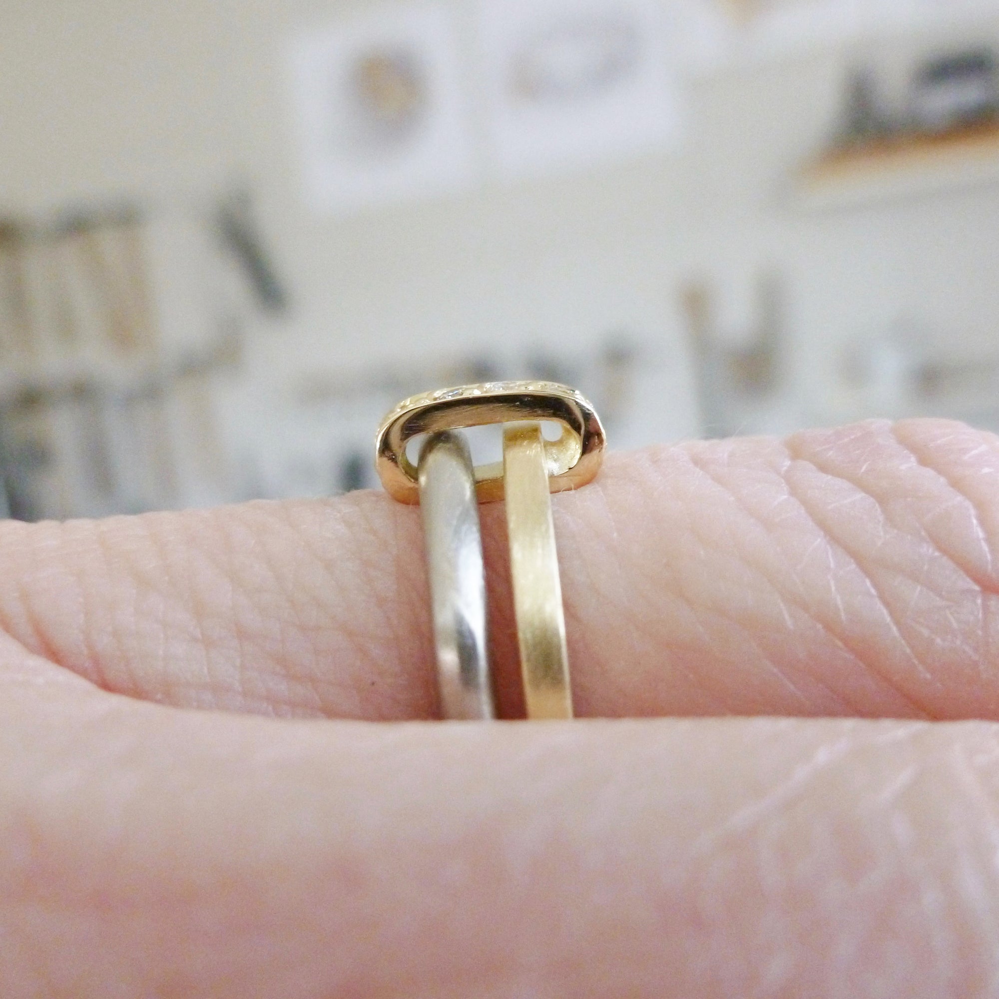 Modern and bespoke two band two tone ring with pave set diamonds. Modern, unique two band ring joined together with diamonds. An alternative eternity or wedding ring. Multi band ring or interlocking ring, sometimes called double band ring too.