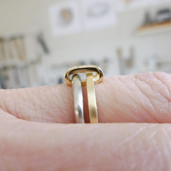 Modern and bespoke two band two tone ring with pave set diamonds. Modern, unique two band ring joined together with diamonds. An alternative eternity or wedding ring. Multi band ring or interlocking ring, sometimes called double band ring too.
