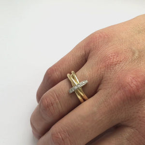 A unique contemporary unique two tone gold and diamond ring