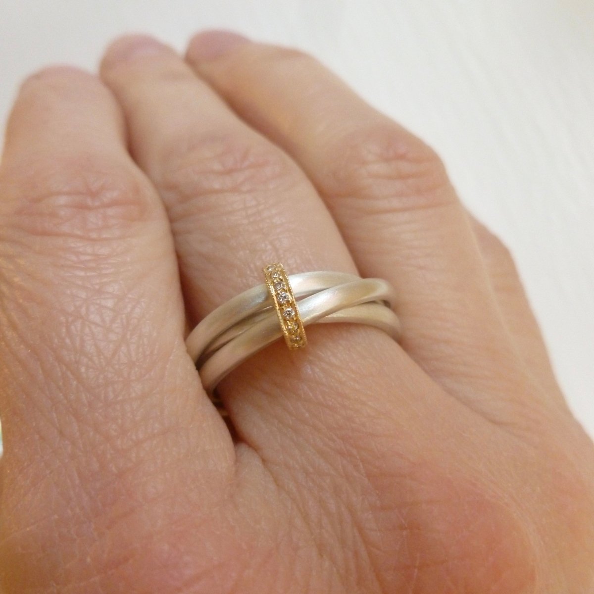 modern silver and gold two tone Russian style wedding ring with diamonds 