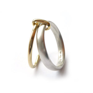 Simple and modern two band stacking ring in silver and gold, an alternative wedding or dress ring
