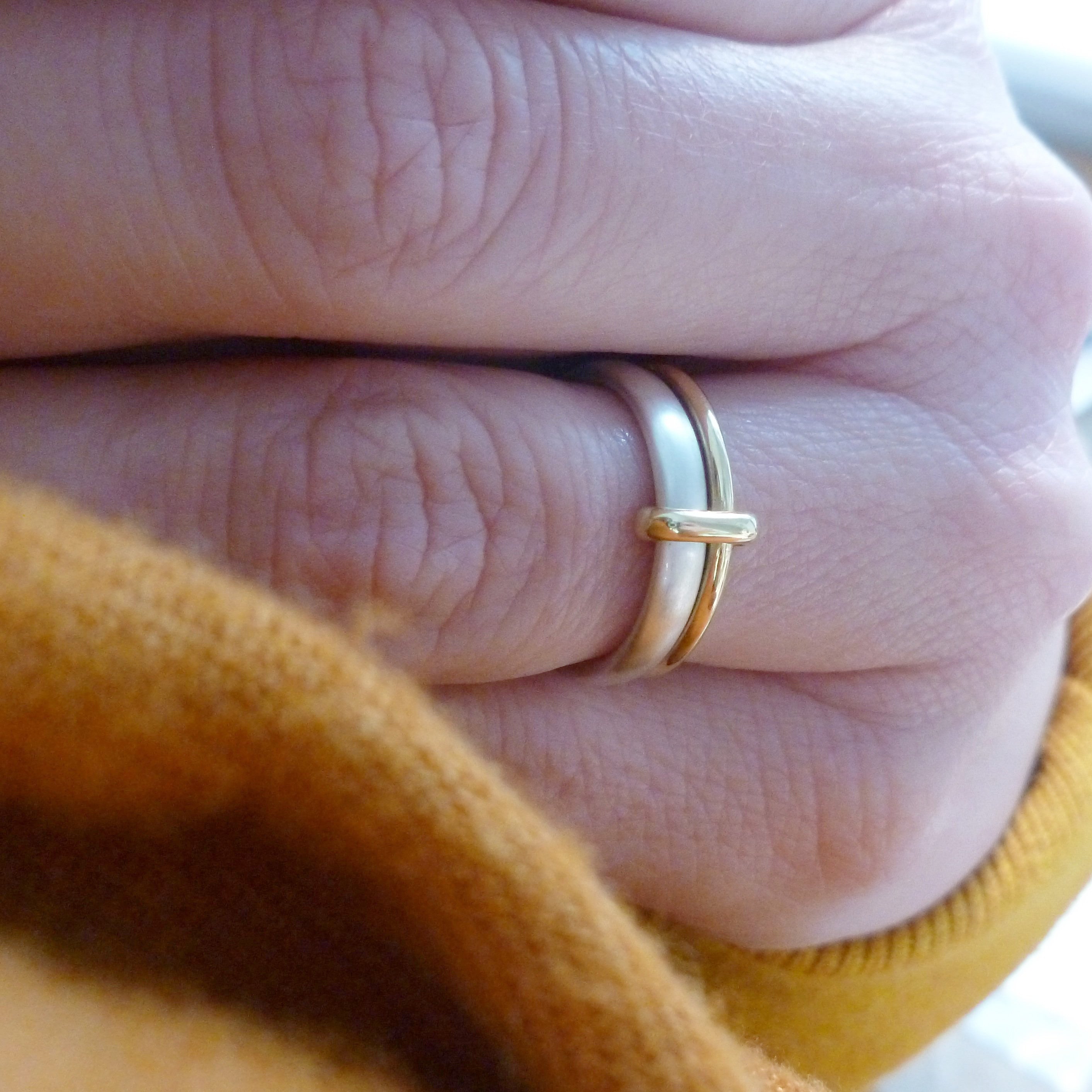 Simple and modern two band stacking ring in silver and gold, an alternative wedding or dress ring