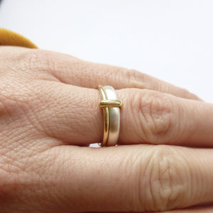 Simple and modern two band stacking ring in silver and gold, an alternative wedding or dress ring