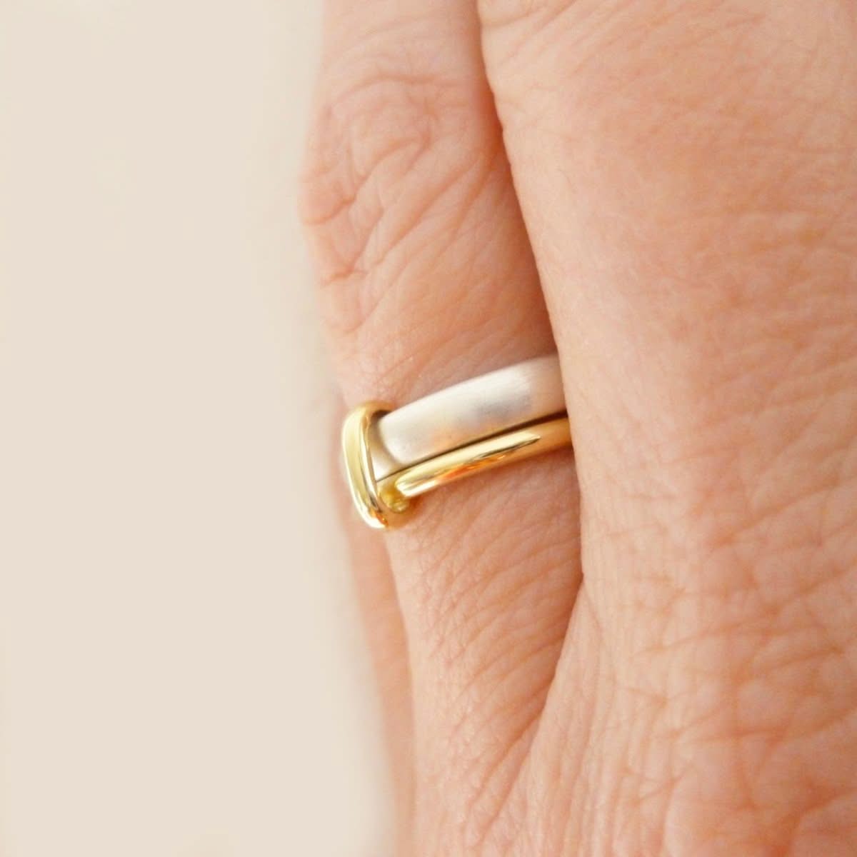 Simple and modern handmade two band stacking ring in silver and gold, an alternative wedding or dress ring